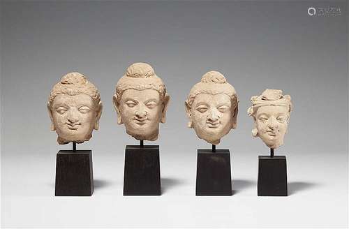 Three small Gandhara stucco heads of Buddha and one small stucco head of a Bodhisattva. Pakistan. 3rd/4th century