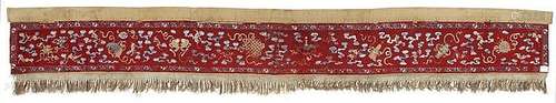 A red felt and silk embroidered long and narrow wall hanging. Late 19th century