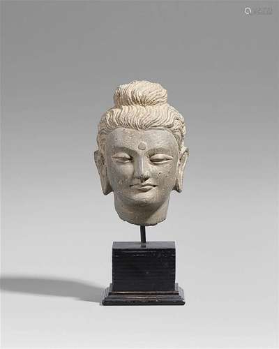 A small Gandhara grey schist head of a Buddha. Pakistan. 2nd/3rd century