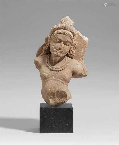 A Central Indian sandstone torso of the fire god Agni. 11th/12th century