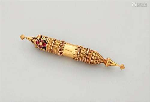 A gold pendant (thali) of a tratitional Nattukottai Chettiar caste marriage necklace (kazhuththu uru). Sothern India