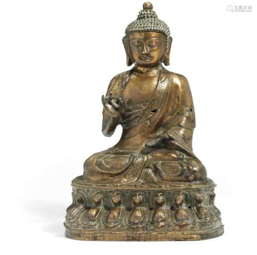 A Chinese bronze Buddha seated in meditating position on a double lotus throne. Late Ming, 17th century. H. 30 cm.