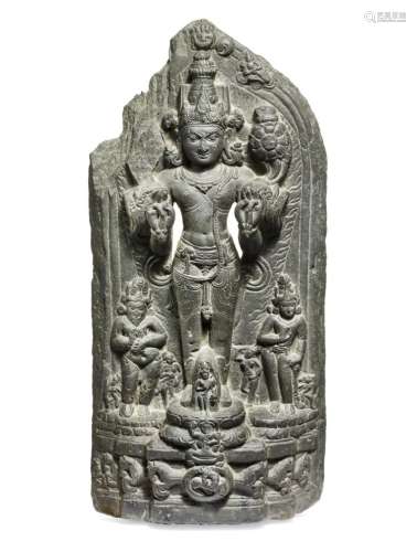 An Indian schist stele relief of Surya. Pala period, 12th century. H. 57 cm.