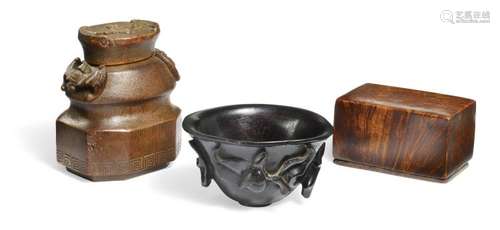 A collection of scolar objects small cup of zitan, bamboo box with bats, (bianfu) and a small box of root wood (yingzimu) for seal. Ming and Qing. (3)