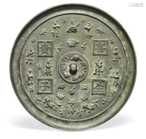 A Chinese late Ming bronze mirror. Weight 4136 gr. Diam. 31.5 cm.