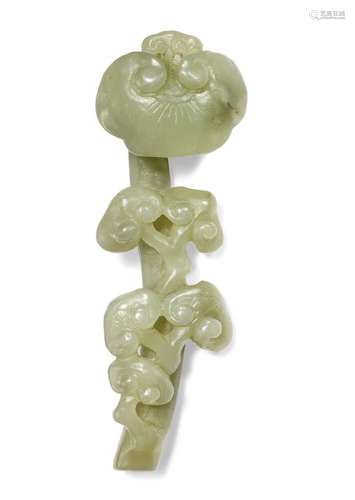 A Chinese miniature greenish jade ruyi sceptre in the shape of a lingzhi. Qing. Weight 41 gr. L. 9 cm.