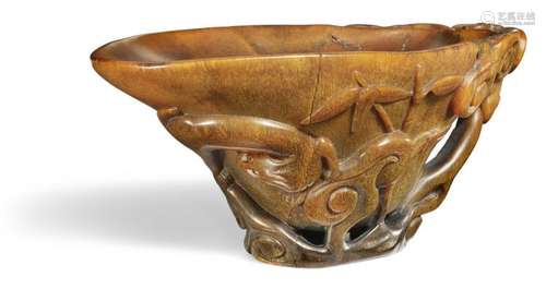 A Chinese rhinoceros libation cup. Ming, 17th century. Weight 261 gr. H. 7 cm. L. 16 cm. W. 10,5 cm.