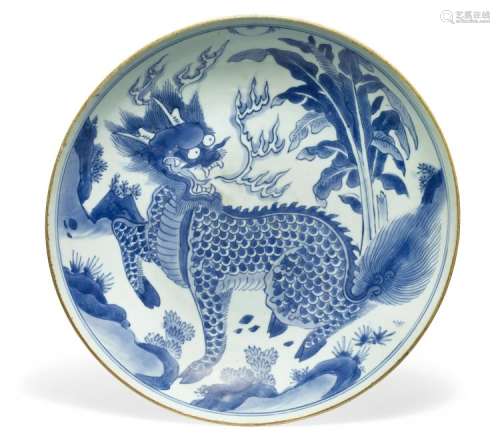 A Chinese blue and white porcelain dish decorated with a qilin. Signed Yu Tang Jia Qi in doulbe-circle mark. Mid 17th century. Diam. 36 cm.