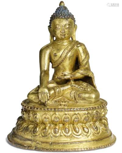 A Tibetan gilt bronze figure of Akshobhya Buddha. 15th century. Weight 299 gr. H. 10 cm.