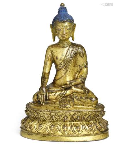 A Tibetan gilt bronze figure of Akshobhya Buddha. Sealed bottom. 16th century. Weight 435 gr. H. 15 cm.