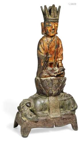A Chinese patinated and partly lacquer gilt bronze Buddha. Ming 1368-1644. Weight 2874 gr. H. 32 cm.