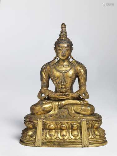 A Chinese gilt bronze figure of Amitayus. Qianlong, 1736-1795. Weight 1465 gr. H. 17.5 cm.