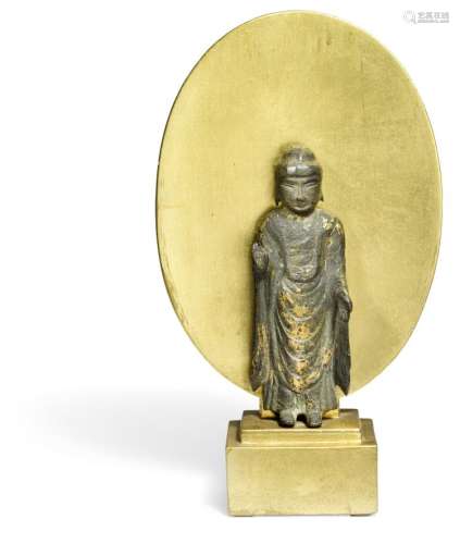 A gilt-bronze standing figure of Buddha. Unified Silla Dynasty, 8th - 9th century. H. 13 cm.