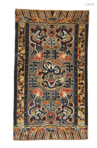 A Qing dynasty(1644-1911) silk and metal thread dragon rug, China. Late Qing Dynasty. 207 x 125 cm.