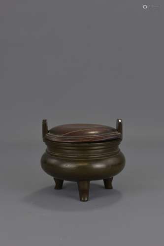 A CHINESE BRONZE CENSER AND HARDWOOD COVER