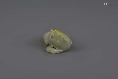 A CHINESE CARVED WHITE JADE LION