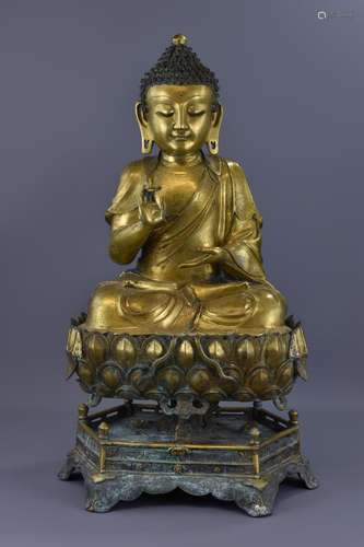 A LARGE CHINESE GILT BRONZE BUDDHA ON LOTUS STAND