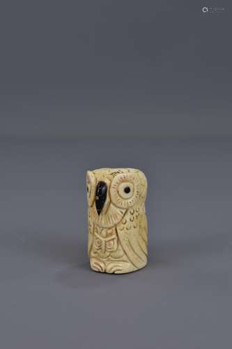 AN ORIENTAL CARVED IVORY OWL