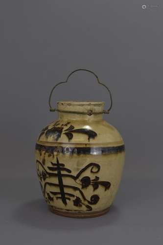 A CHINESE MING DYNASTY POTTERY JAR