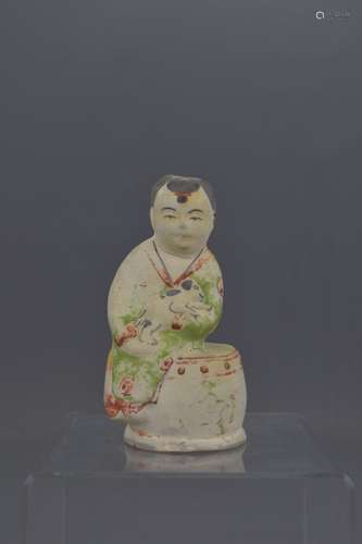 A CHINESE YUAN DYNASTY POTTERY FIGURE