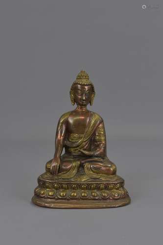 A TIBETAN COPPER / BRONZE BUDDHA