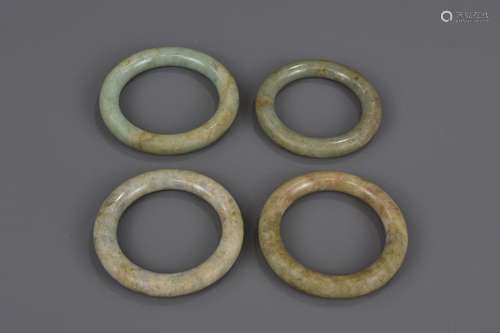 FOUR CHINESE JADE BANGLES