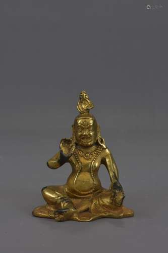 A TIBETAN GOLD GILDED BRONZE FIGURE