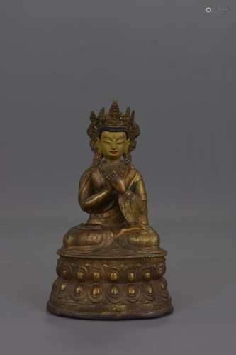 A TIBETAN GOLD GILDED BRONZE FIGURE