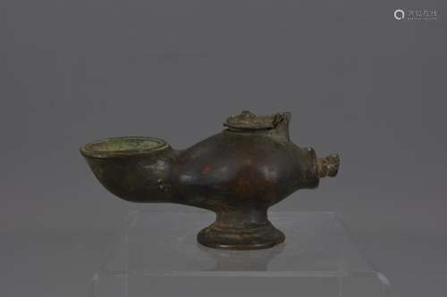 A MIDDLE EASTER BRONZE OIL LAMP