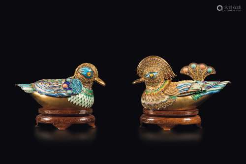 A pair of gilt silver ducks with polychrome enamel profiles, China, Qing Dynasty, 19th century