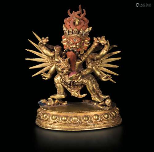 A gilt bronze figure of Mahakala on a lotus flower, Tibet, 19th century