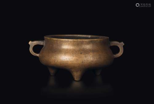 A tripodal gilt bronze censer with handles, China, Qing Dynasty, 18th century