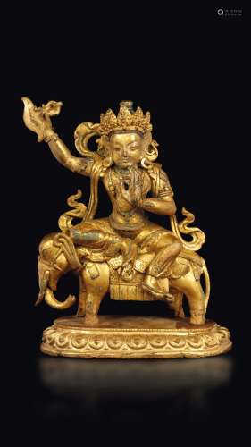 A gilt bronze figure of Samantabhadra with karttrka seated on an elephant, Tibet, 18th century