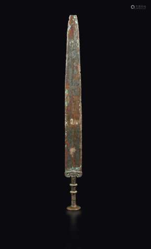A bronze sword with a Taotie mask decor on the hilt, China, Han Dynasty (206 b.C.-220 A.D.)