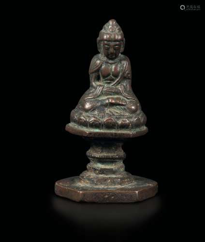A semi-gilt bronze Sakyamuni figure, China, Ming Dynasty, 15th century