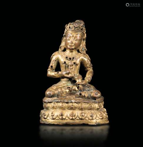 A Tara figure seated on a double lotus with semi-precious stone inlays, Tibet, 15th century