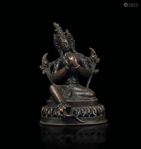 A bronze figure of Avalokitesvara seated on a lotus flower, Tibet/Nepal, 16th century