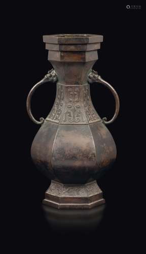 A bronze hexagonal-section vase with an embossed archaic decoration, China, Ming Dynasty, 17th century