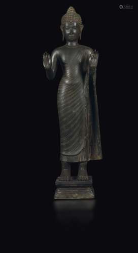 A copper sculpture of a standing Buddha, Thailand, 16th-17th century