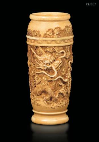 A carved ivory vase with a figure of dragons, China, Qing Dynasty, 19th century