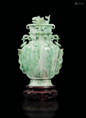 A jadeite vase with ring handles and a lid with a fish handle, China, early 20th century