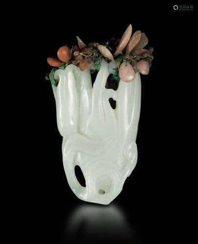 A white jade Buddha hand with semiprecious stone applications, China, Qing Dynasty, late 19th century