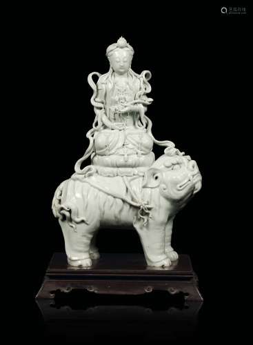 A Blanc de Chine Dehua figure of Manjusri on Pho dog, China, Qing Dynasty, 19th century