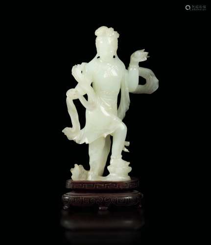 A white jade figure of Guanyin with shell, China, early 20th century