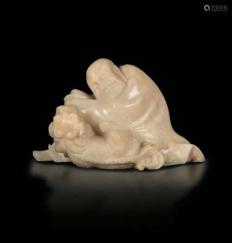 A small soapstone group with a figure of a wiseman and dog, China, Qing Dynasty, 19th century