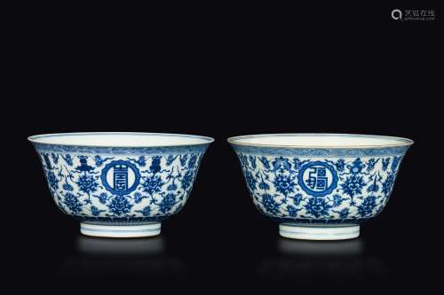 A pair of blue and white bowls with four ruyi-bordered roundels enclosing stylised characters, China, Qing Dynasty, Qianlong Mark and of the Period (1735-1795)
