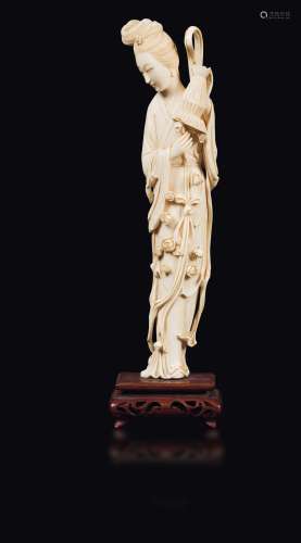 A carved ivory Guanyin with a basket, China, early 20th century