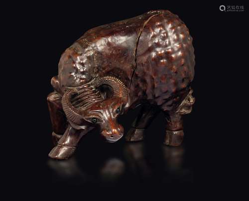 A carved wood buffalo with glass eyes, China, Qing Dynasty, 19th century