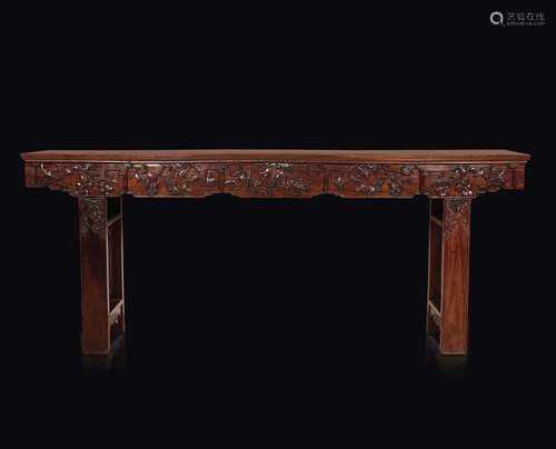 An important homu wood console table with a naturalistic decor, China, Qing Dynasty, 19th century