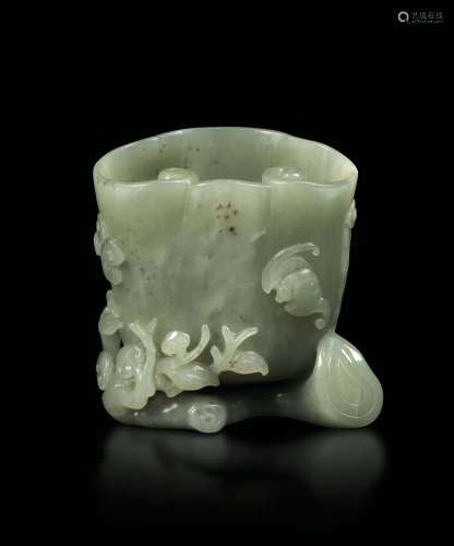 A jade cup with a decor of naturalistic elements and bats, China, Qing Dynasty, Qianlong period (1736-1796)